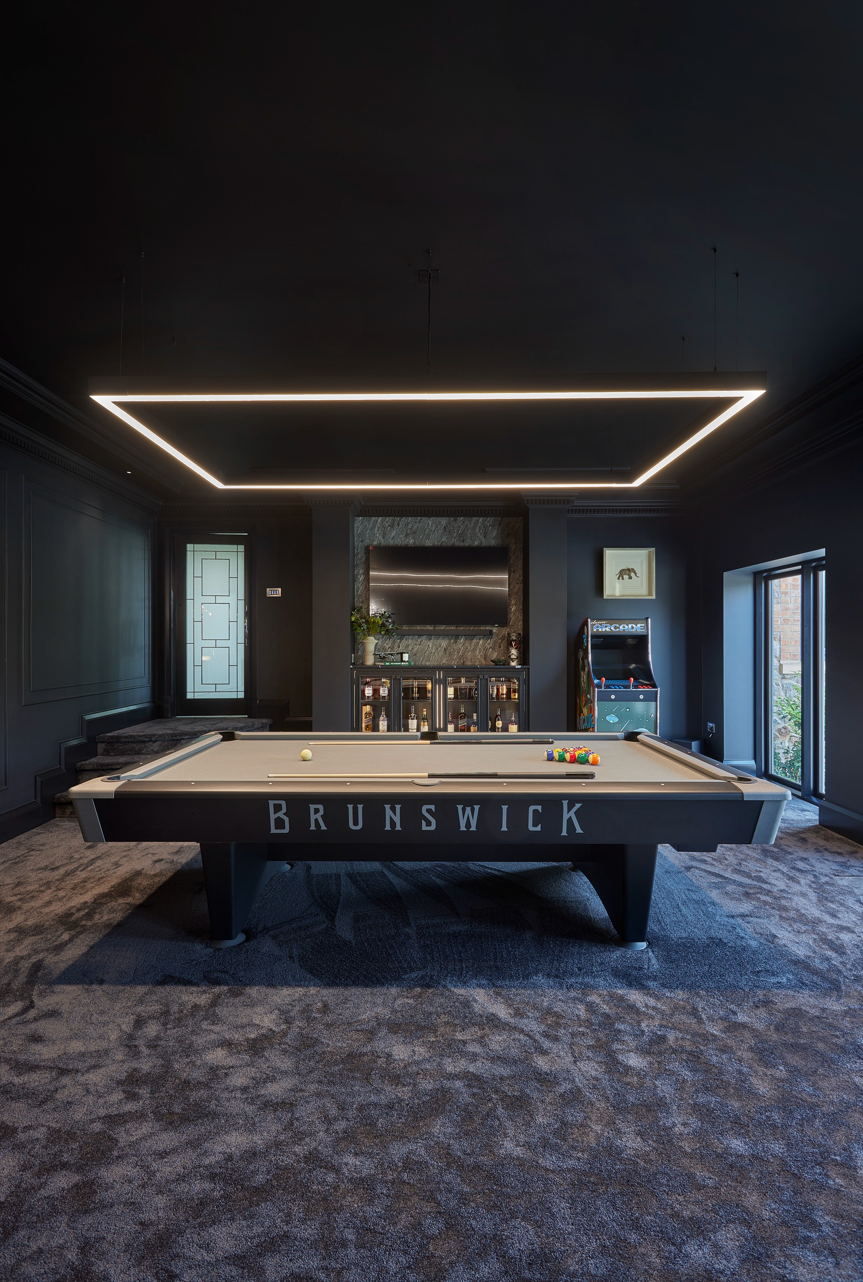 Bespoke luxury entertainment room with home bar, custom cabinetry and interior design in Richmond, London