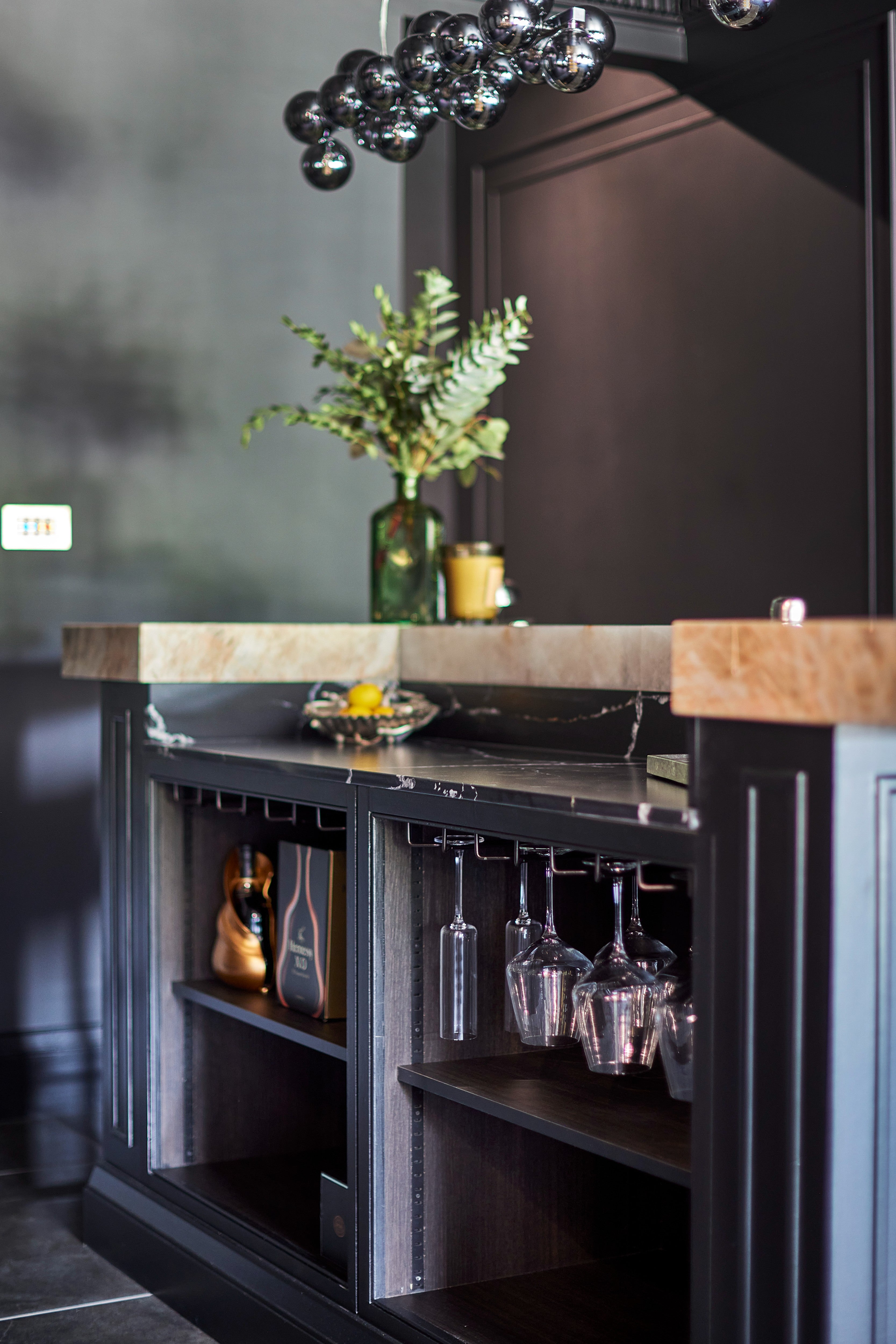 Dark bespoke cabinetry designed for a luxury entertaining space. London, Richmond